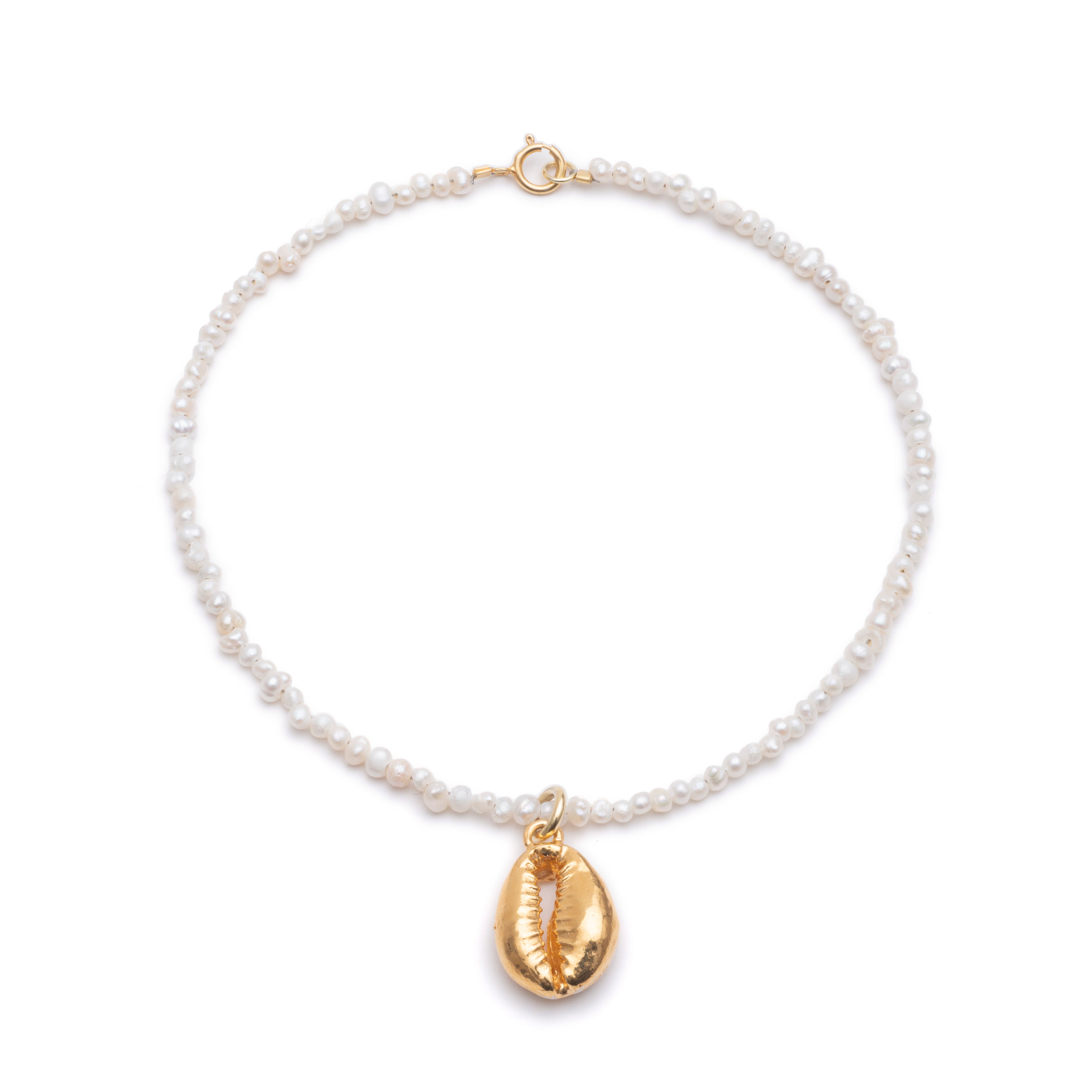 Pearl bracelet and shell pendant